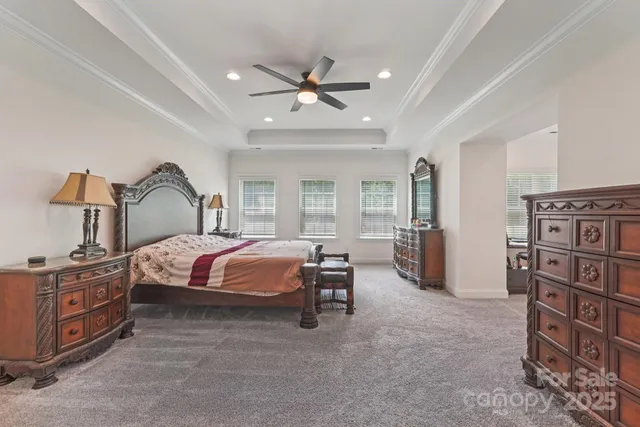 a bedroom with a bed furniture and a window