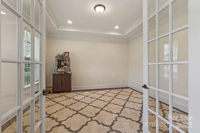 a view of a livingroom with wooden floor and a window