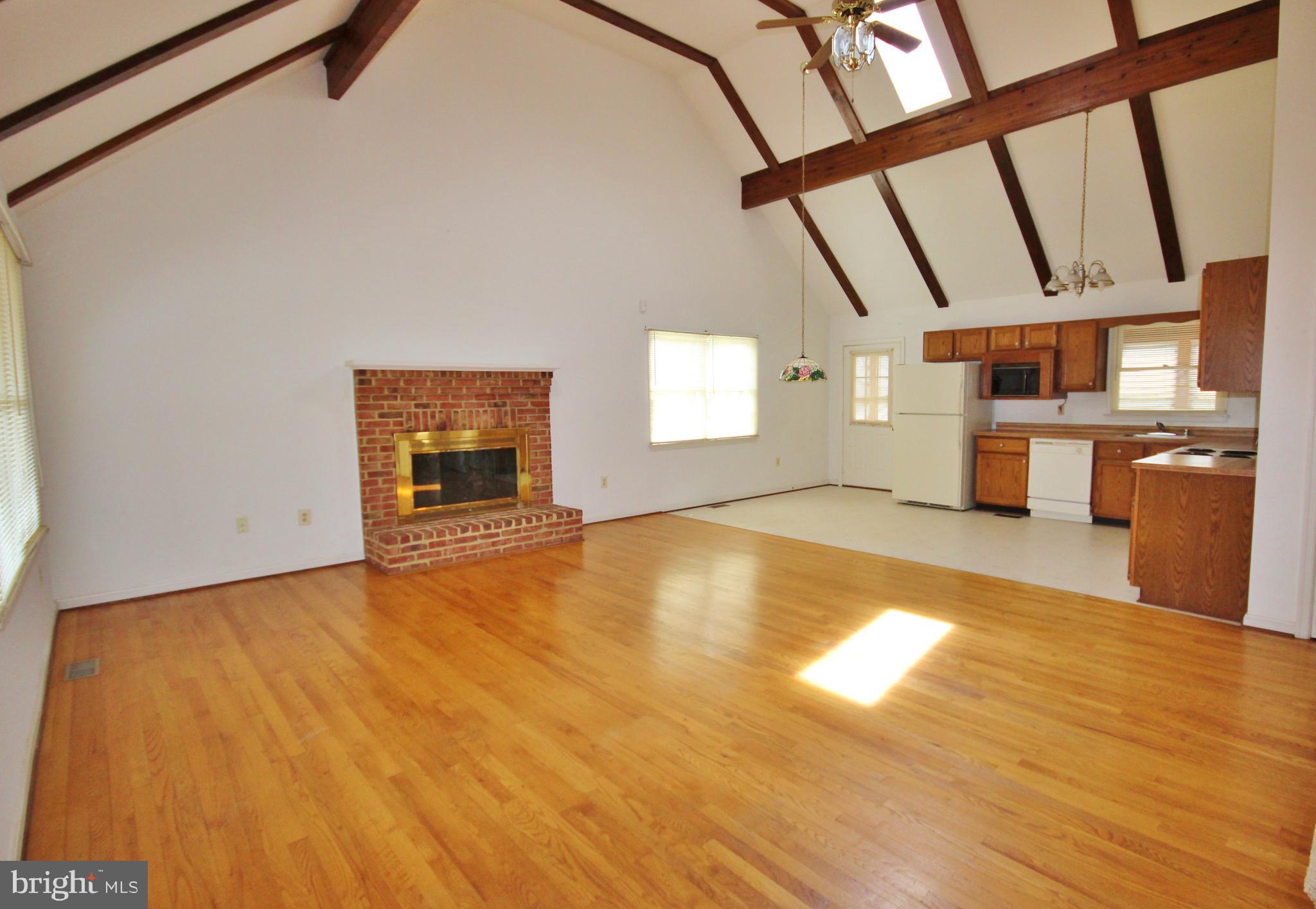 312 Granny Smith Road Linden, VA 22642 - Photo 7 of 59 Wood floors and fireplace in great room