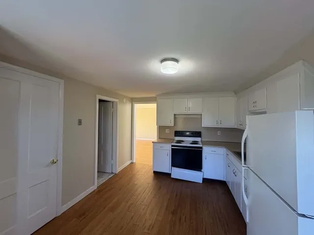 a kitchen with granite countertop cabinets and steel stainless steel appliances