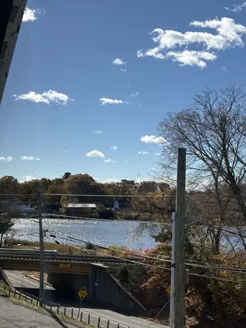 a view of a lake with a yard