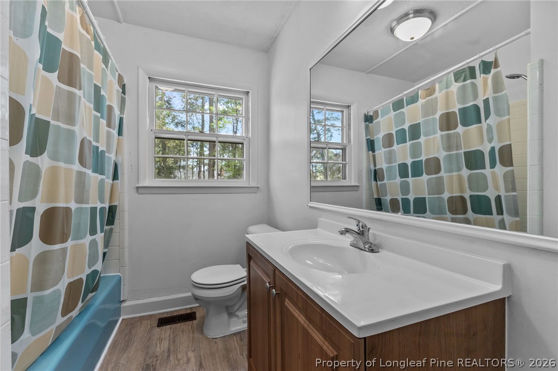 908 Ruton Court Fayetteville, NC 28303 - Photo 21 of 29 a bathroom with a sink toilet and shower
