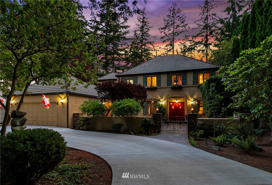 654 Clark Road Bellingham, WA 98225 - Photo 2 of 40 a front view of a house with a yard and a garden