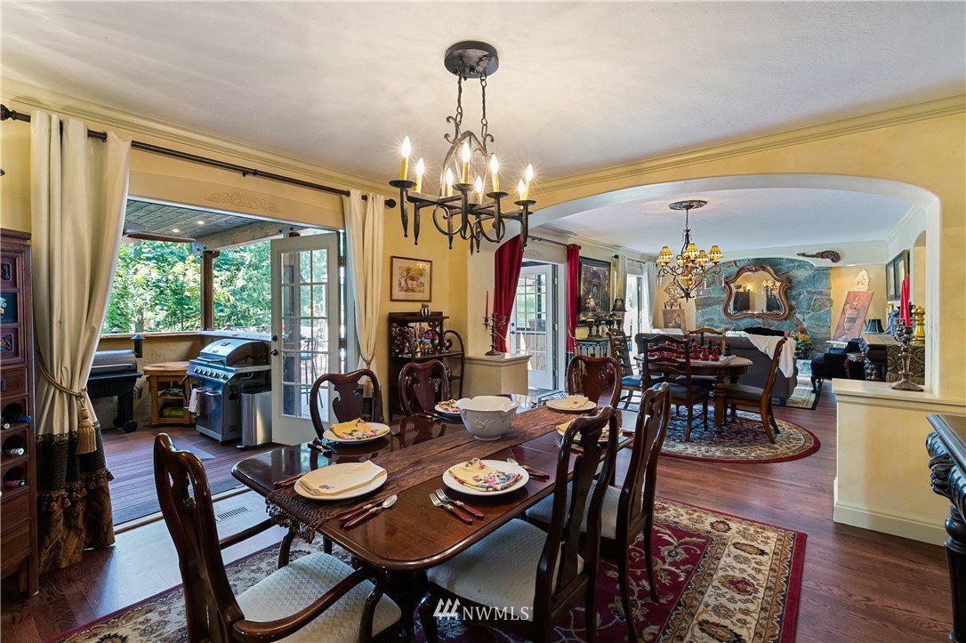 654 Clark Road Bellingham, WA 98225 - Photo 13 of 40 a view of a dining room with furniture window and wooden floor