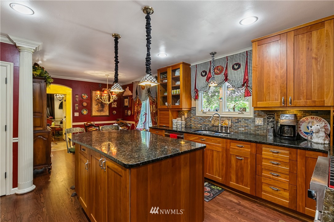 654 Clark Road Bellingham, WA 98225 - Photo 20 of 40 a kitchen with stainless steel appliances granite countertop sink stove and refrigerator