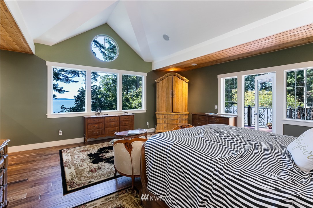 654 Clark Road Bellingham, WA 98225 - Photo 23 of 40 a bedroom with furniture and a large window