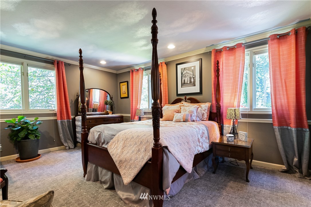 654 Clark Road Bellingham, WA 98225 - Photo 27 of 40 a bed room with a bed window and potted plant