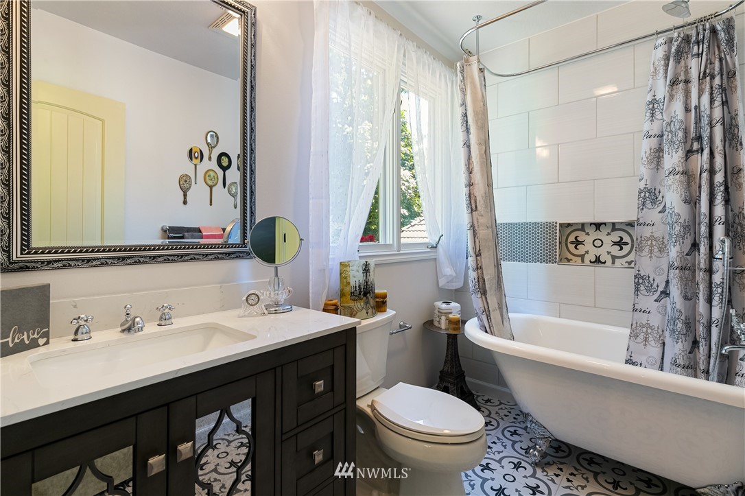 654 Clark Road Bellingham, WA 98225 - Photo 28 of 40 a bathroom with a sink and a mirror