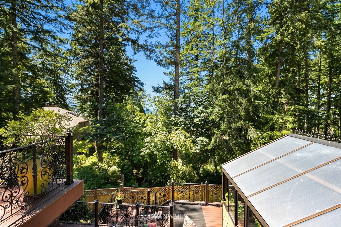 654 Clark Road Bellingham, WA 98225 - Photo 30 of 40 a view of a patio with table and chairs and wooden fence