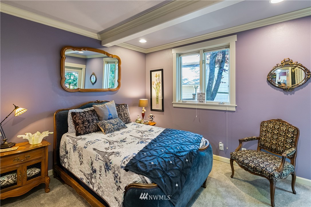 654 Clark Road Bellingham, WA 98225 - Photo 33 of 40 a bedroom with a bed and a chair