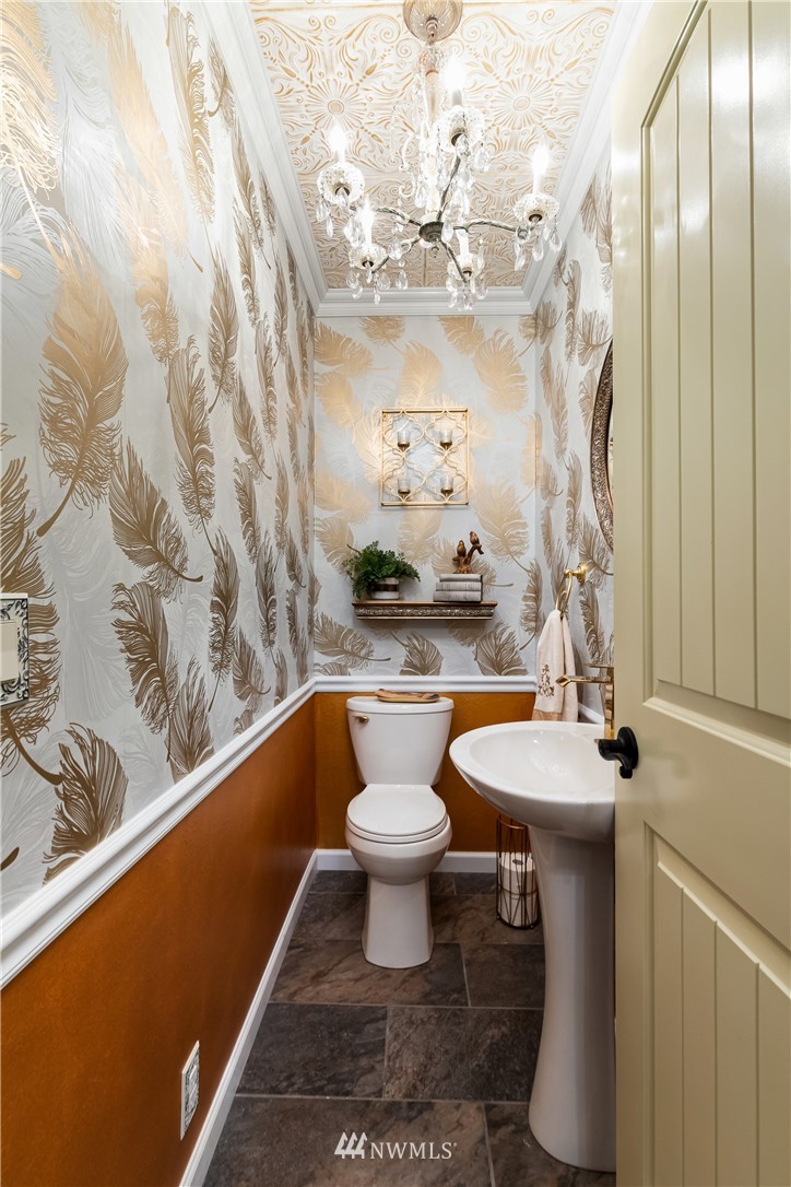 654 Clark Road Bellingham, WA 98225 - Photo 36 of 40 a bathroom with a sink a toilet and a mirror