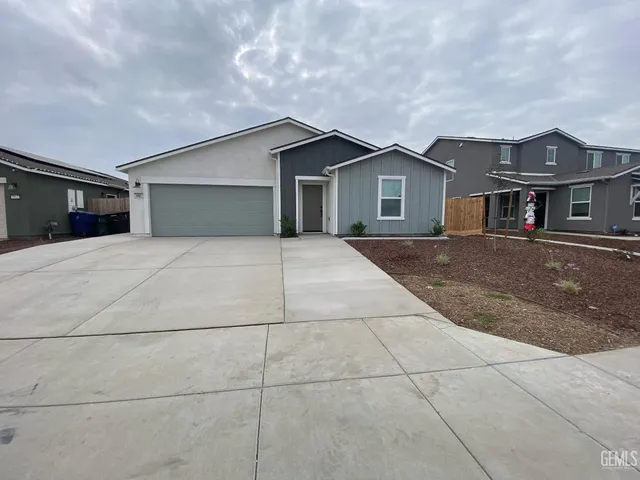 a yellow house with a outdoor space