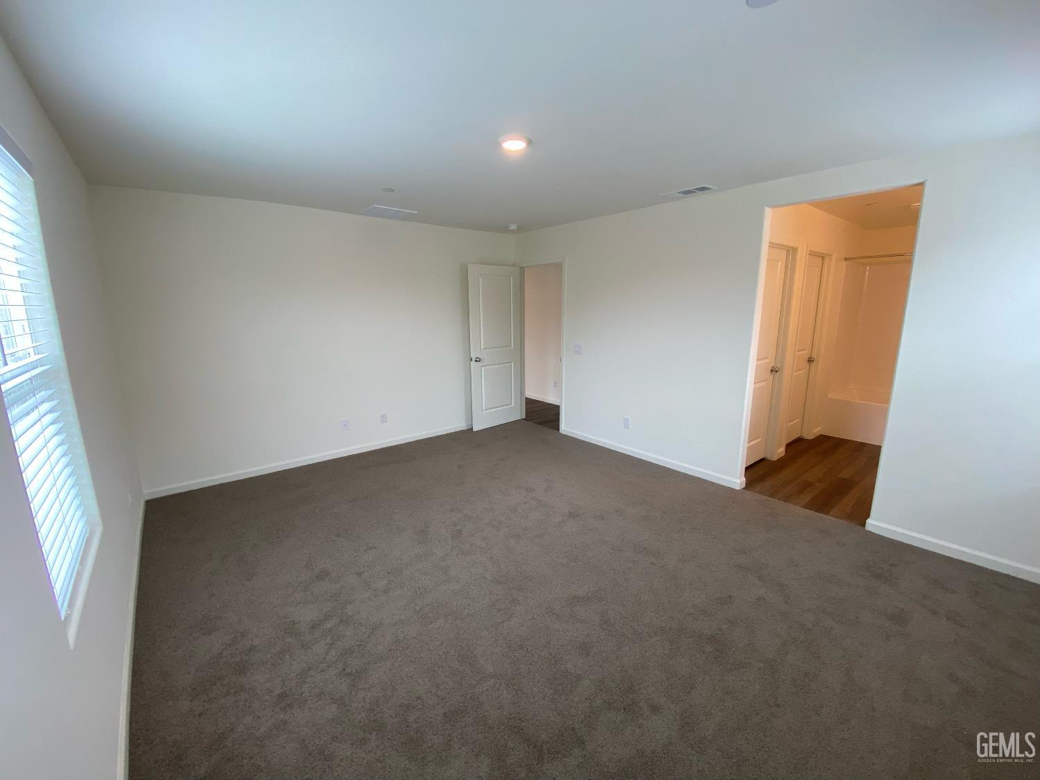 Undisclosed Address Bakersfield, CA 93313 - Photo 11 of 26 an empty room with a window