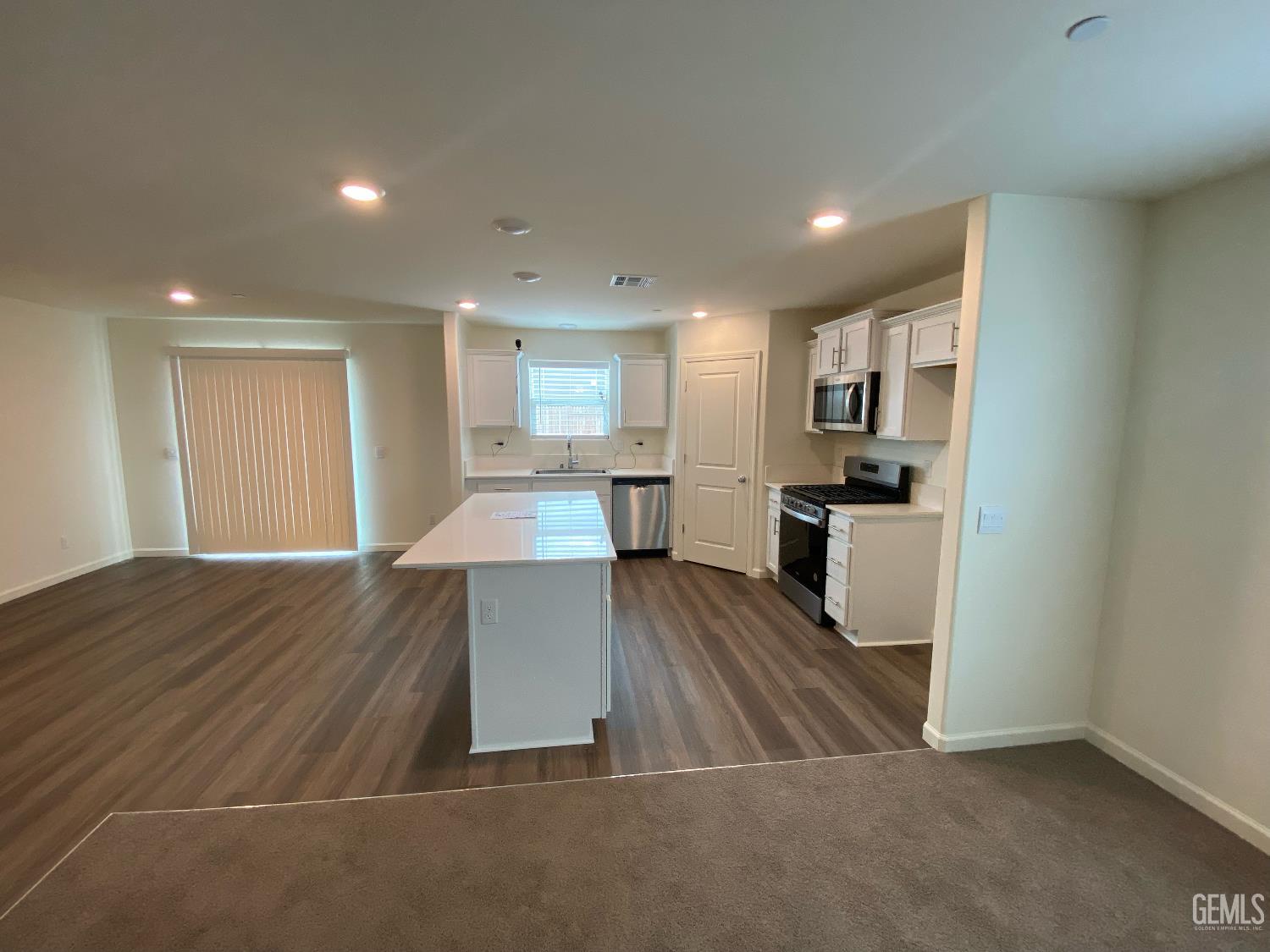 Undisclosed Address Bakersfield, CA 93313 - Photo 12 of 26 a view of kitchen with sink microwave and refrigerator