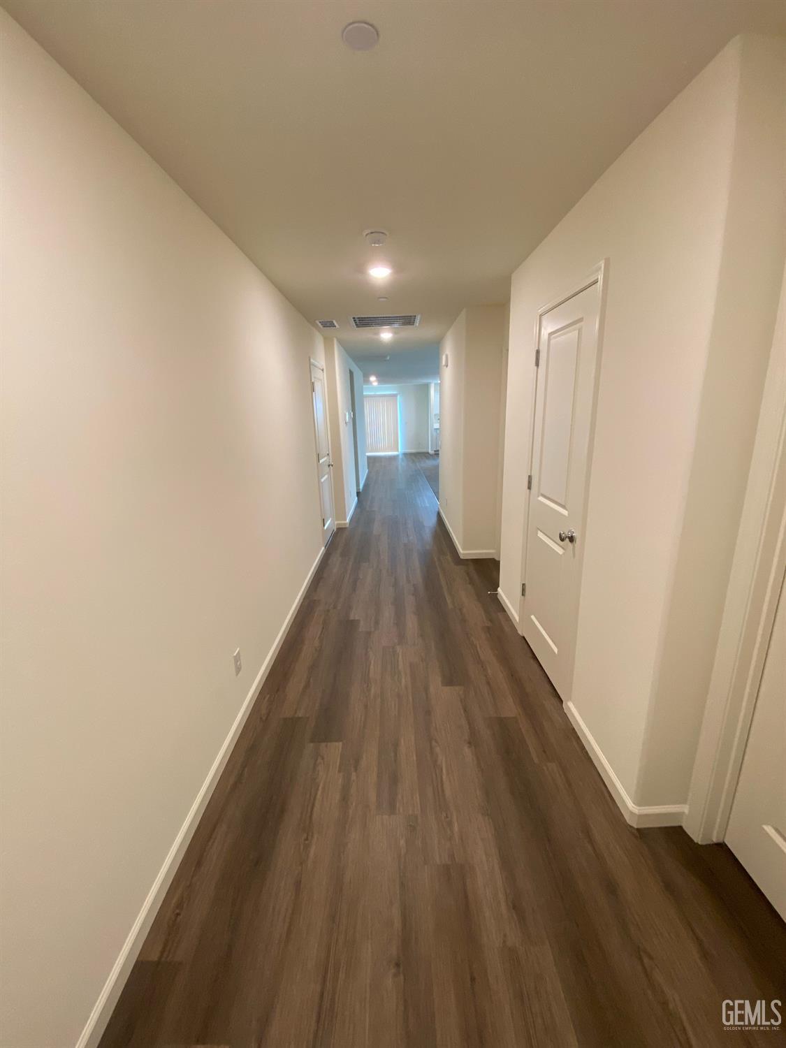 Undisclosed Address Bakersfield, CA 93313 - Photo 15 of 26 a view of gallery with wooden floor