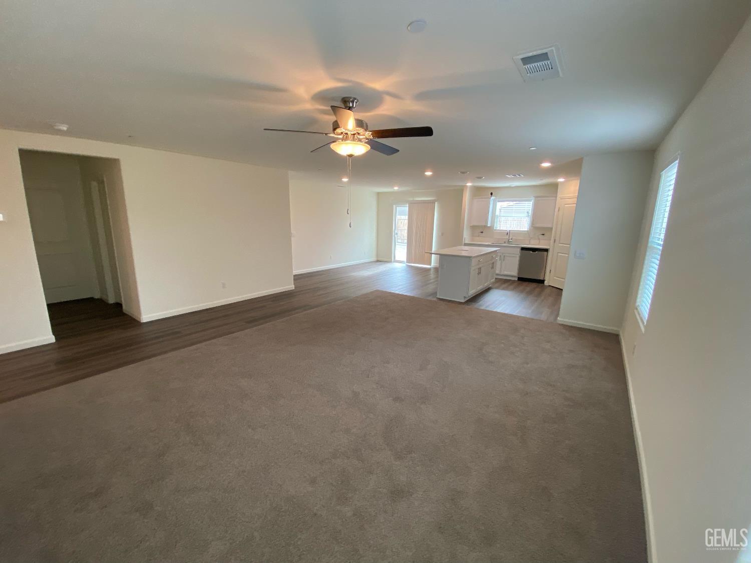 Undisclosed Address Bakersfield, CA 93313 - Photo 16 of 26 a view of a livingroom with a ceiling fan and window