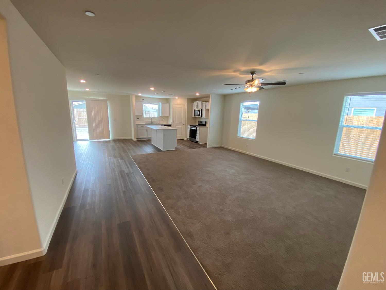 Undisclosed Address Bakersfield, CA 93313 - Photo 18 of 26 wooden floor in an empty room with a window