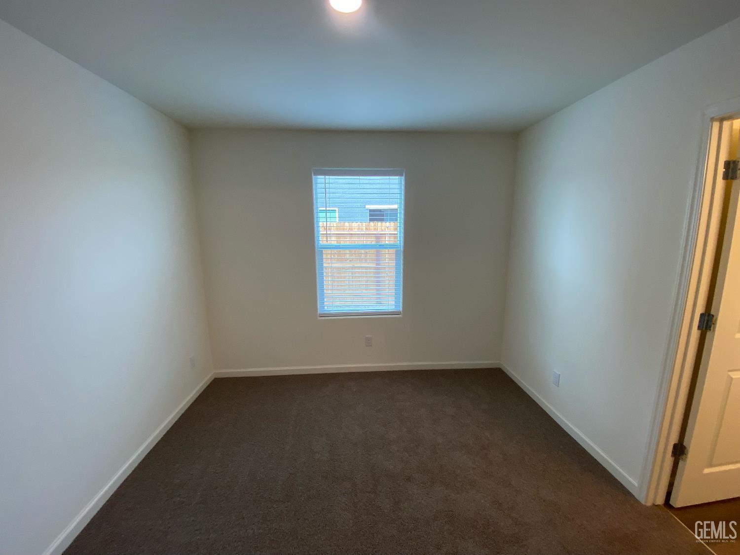 Undisclosed Address Bakersfield, CA 93313 - Photo 20 of 26 an empty room with a window