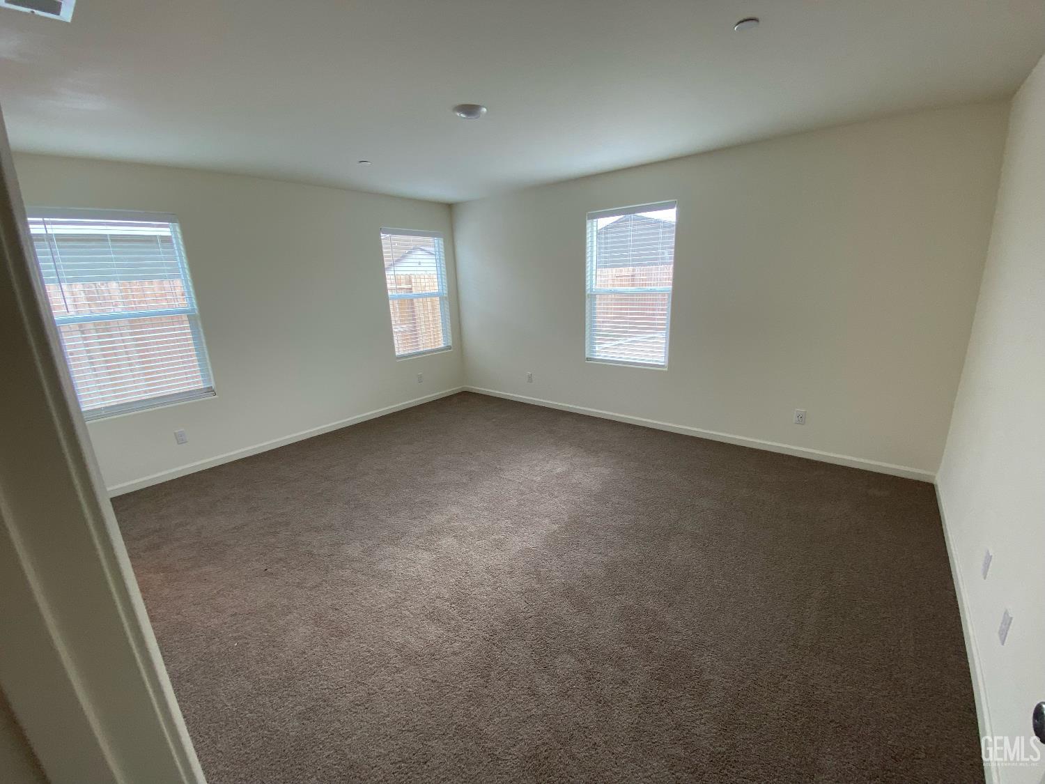 Undisclosed Address Bakersfield, CA 93313 - Photo 2 of 26 an empty room with windows