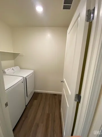 a view of kitchen with cabinets and wooden floor