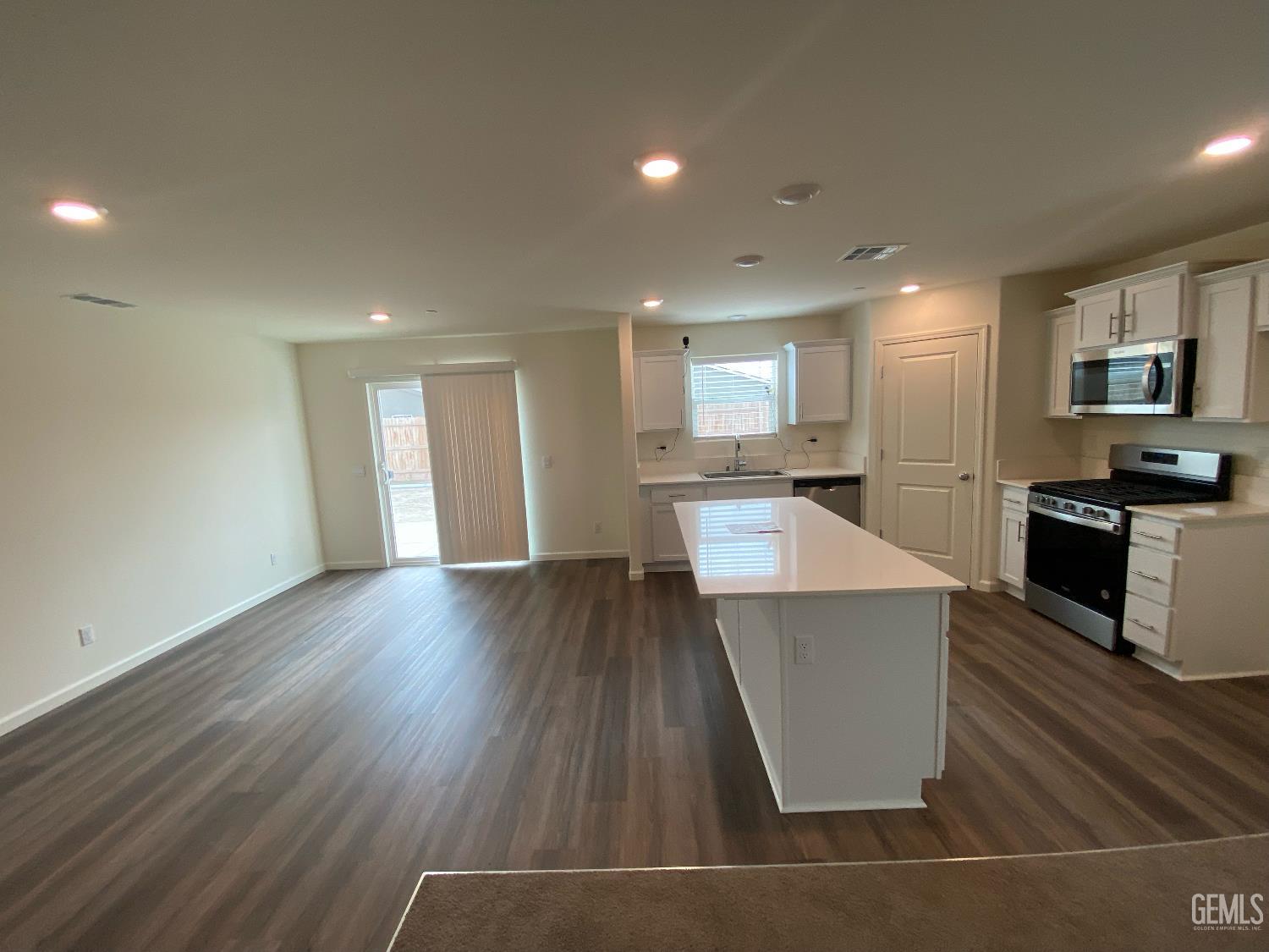 Undisclosed Address Bakersfield, CA 93313 - Photo 22 of 26 a view of kitchen with cabinets and wooden floor