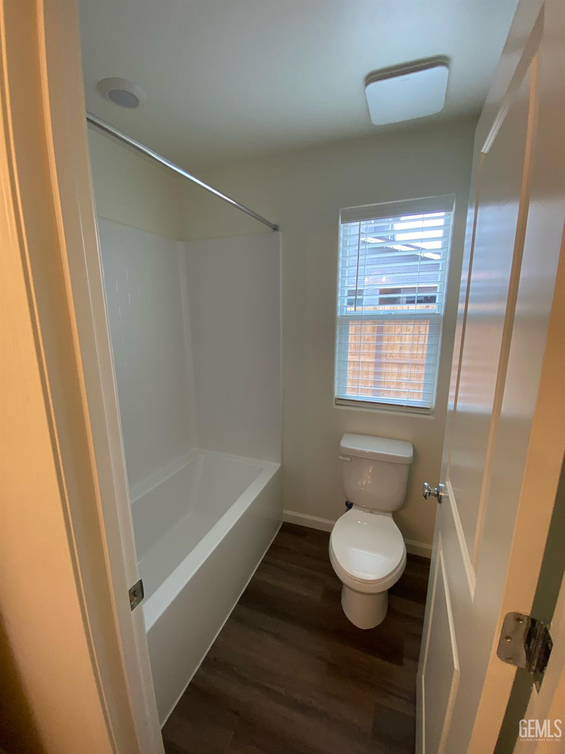 Undisclosed Address Bakersfield, CA 93313 - Photo 4 of 26 a bathroom with a toilet and a shower