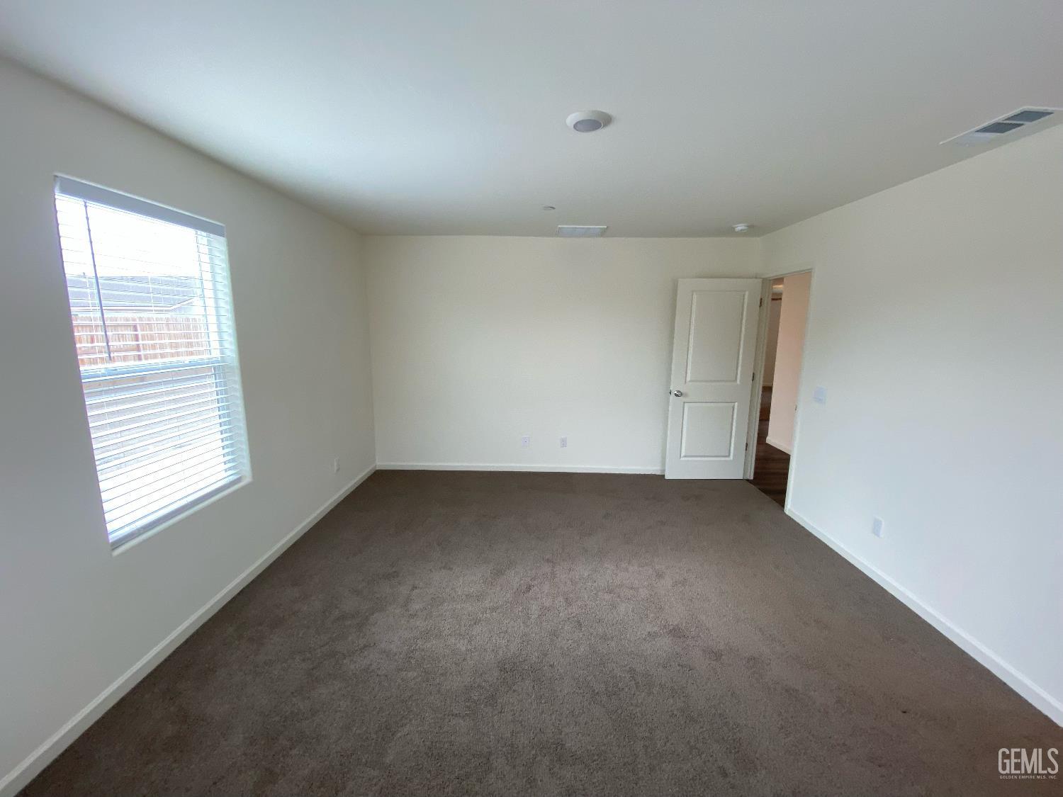Undisclosed Address Bakersfield, CA 93313 - Photo 5 of 26 an empty room with a window