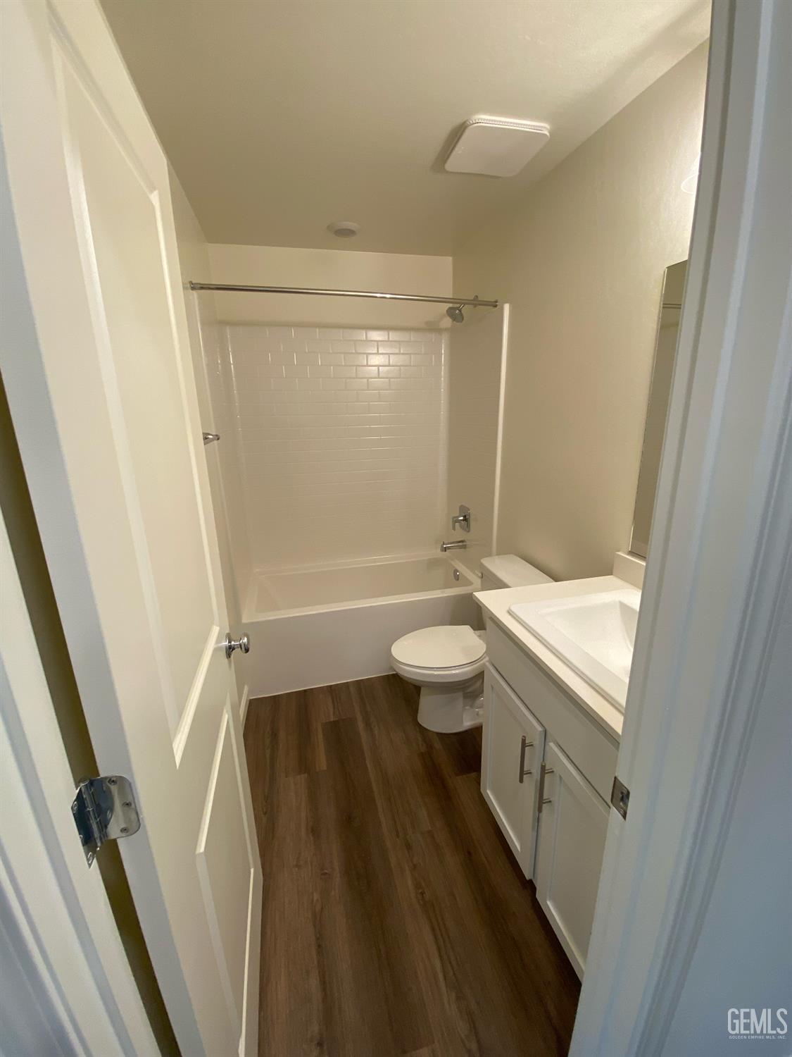 Undisclosed Address Bakersfield, CA 93313 - Photo 7 of 26 a bathroom with a granite countertop sink toilet and shower