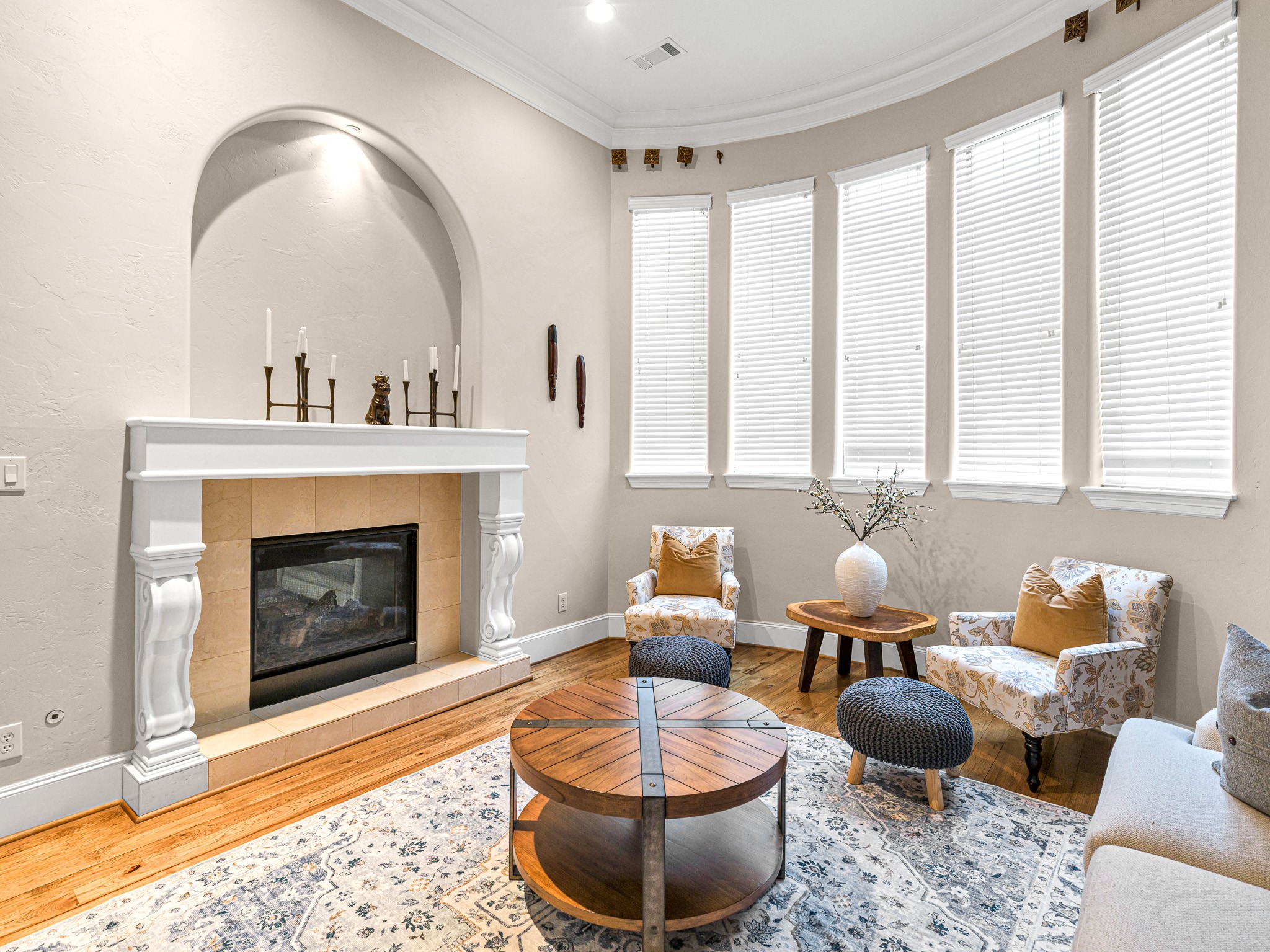4614 Inker Street Houston, TX 77007 - Photo 10 of 36 This formal living room features a double-sided fireplace with decorative molding.