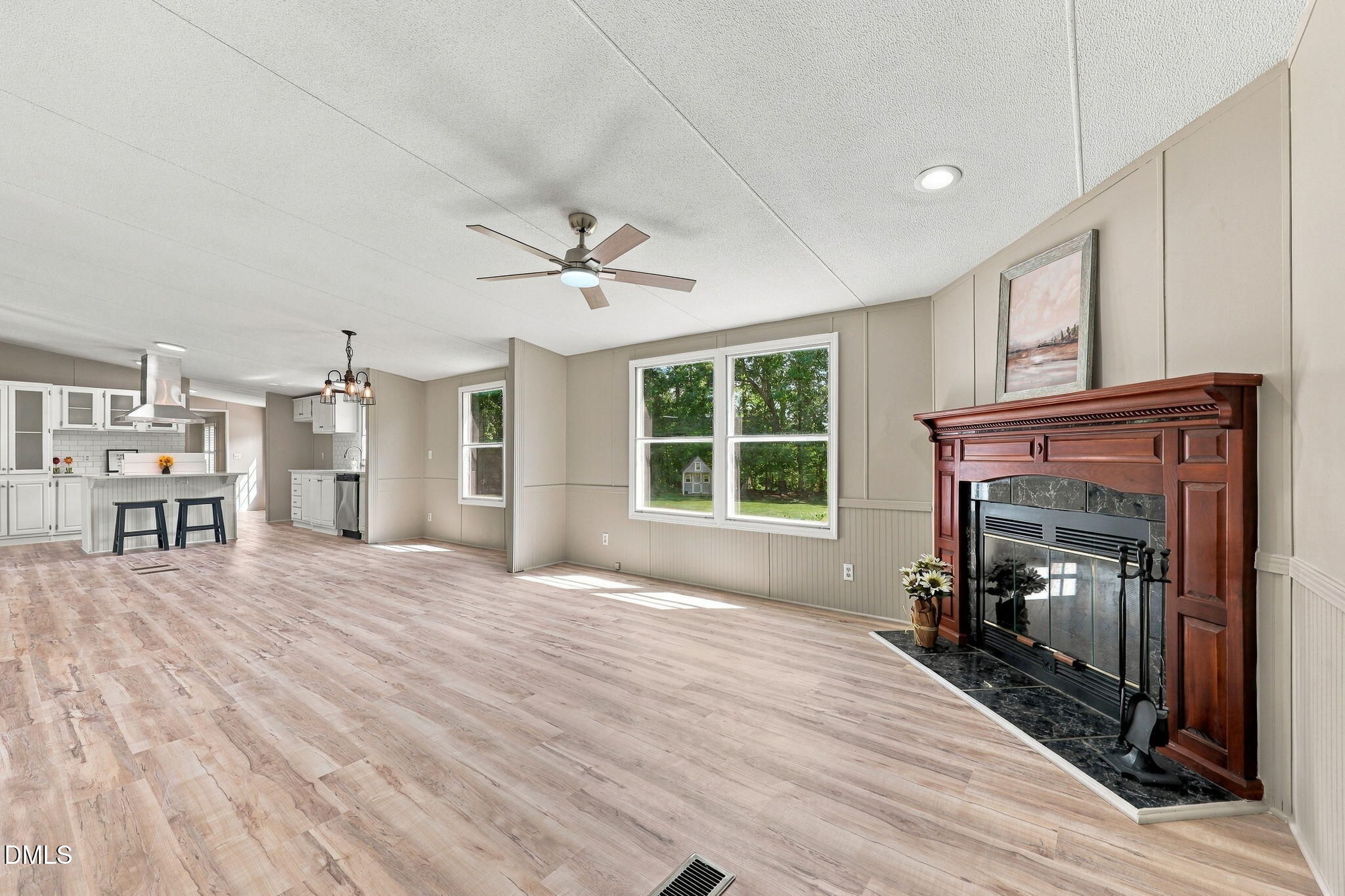 196 Dustin Lane Roxboro, NC 27574 - Photo 23 of 38 Fireplace with Marble Tile and heavy duty Wood finishes