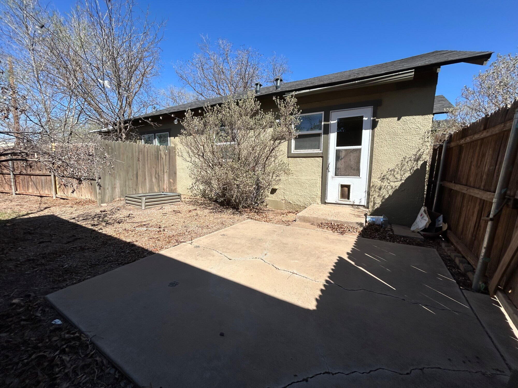 3118 37th Street, Unit FRONT Lubbock, TX 79413 - Photo 14 of 16 a backyard of a house