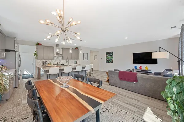 a living room with lots of furniture and a flat screen tv