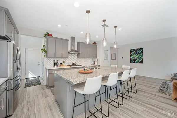 a view of a kitchen and dining room