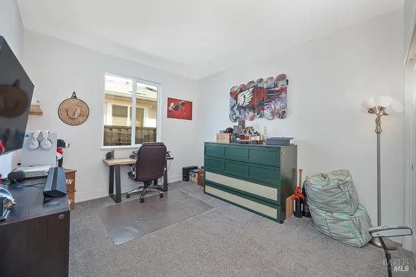 a workspace with furniture and a window