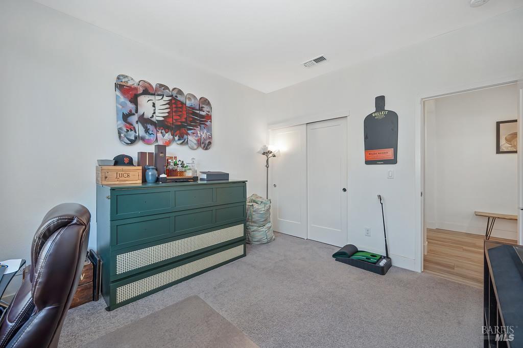 5708 Kassandra Place Rohnert Park, CA 94928 - Photo 21 of 45 a bedroom with a bed and a chandelier