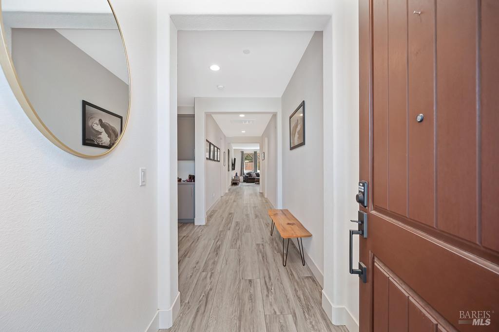 5708 Kassandra Place Rohnert Park, CA 94928 - Photo 3 of 45 a view of a hallway with wooden floor and staircase