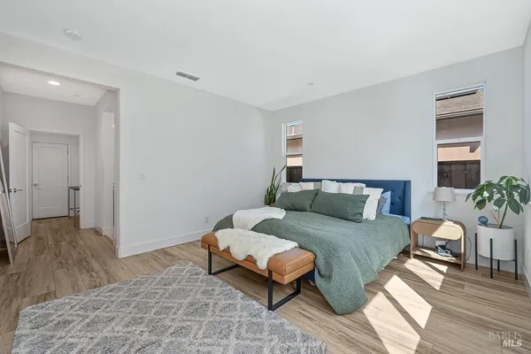 a bedroom with a bed and a couch