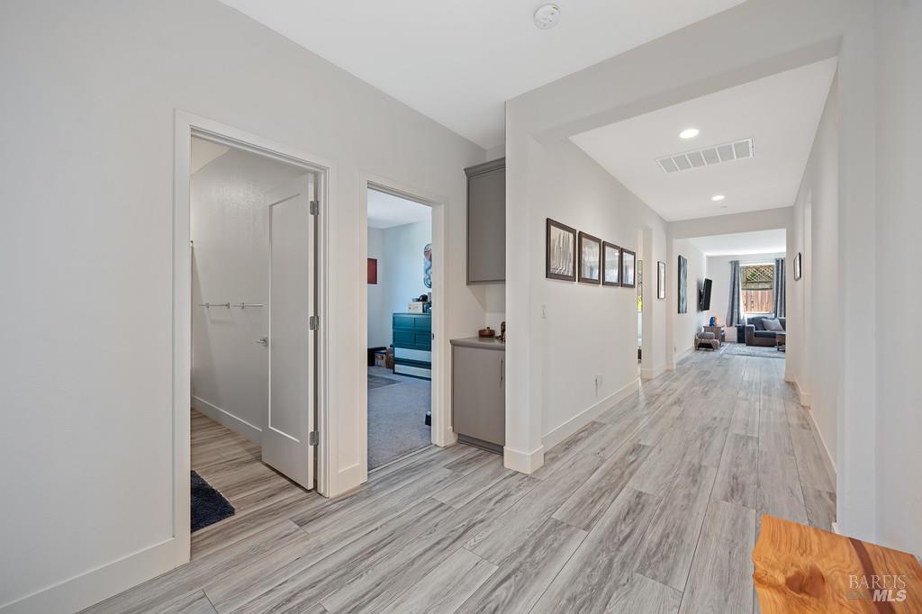 5708 Kassandra Place Rohnert Park, CA 94928 - Photo 5 of 45 a view of a hallway with wooden floor and closet