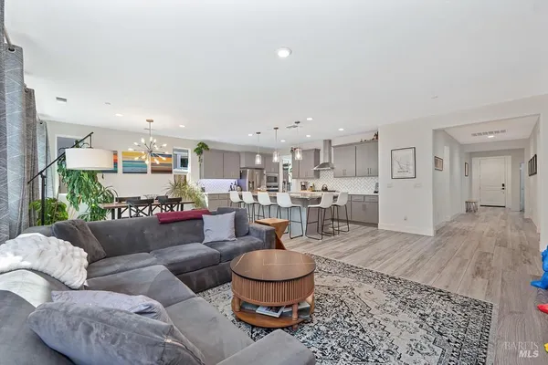 a living room with furniture and a rug