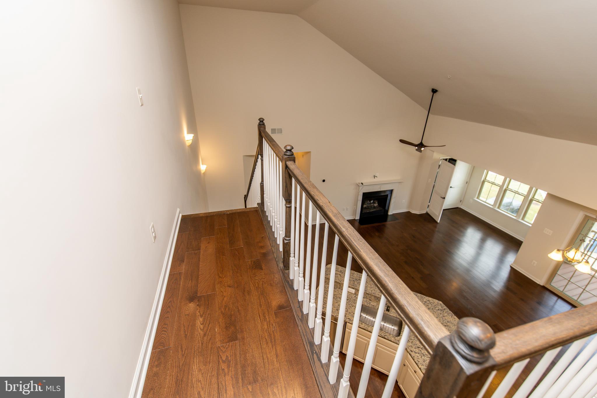 4861 Finnical Way, Unit 401 Frederick, MD 21703 - Photo 18 of 54 a view of entryway and hall with wooden floor