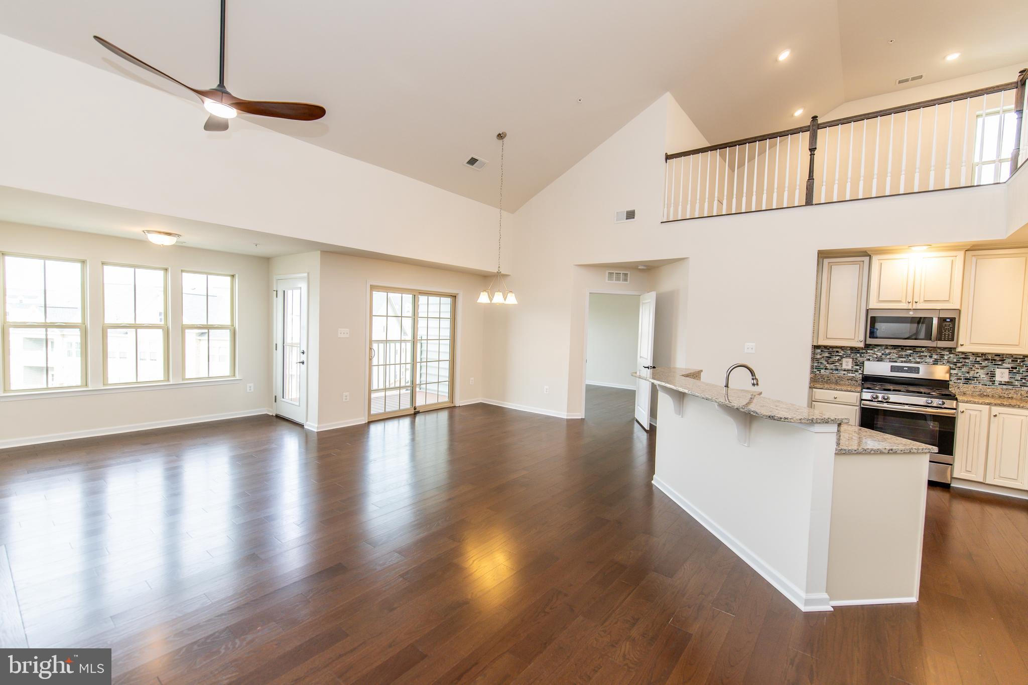4861 Finnical Way, Unit 401 Frederick, MD 21703 - Photo 2 of 53 a view of a kitchen with a sink and a large window