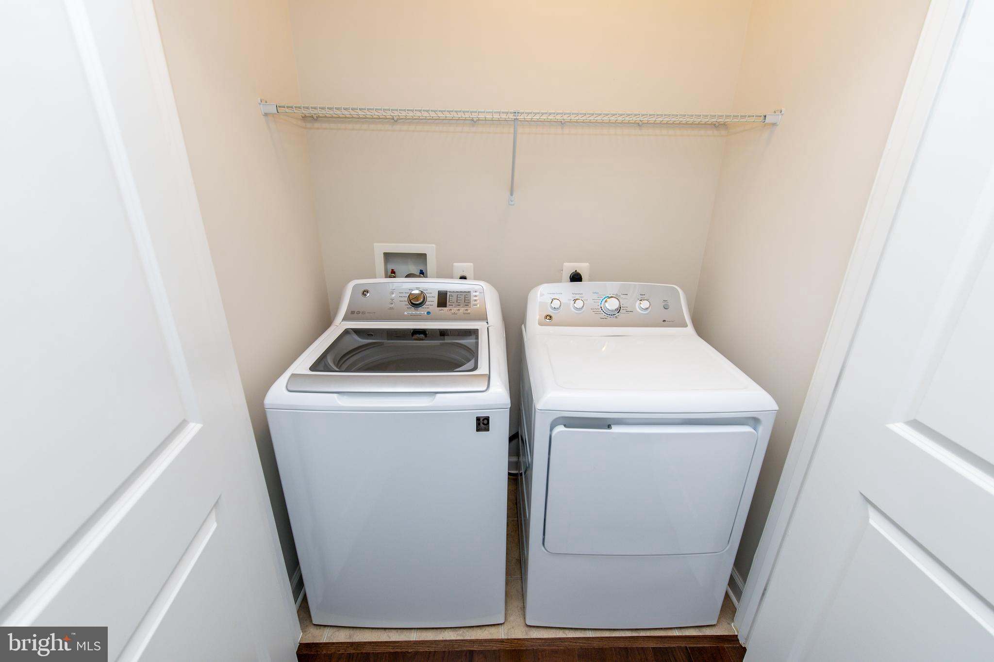 4861 Finnical Way, Unit 401 Frederick, MD 21703 - Photo 22 of 53 a utility room with dryer and washer