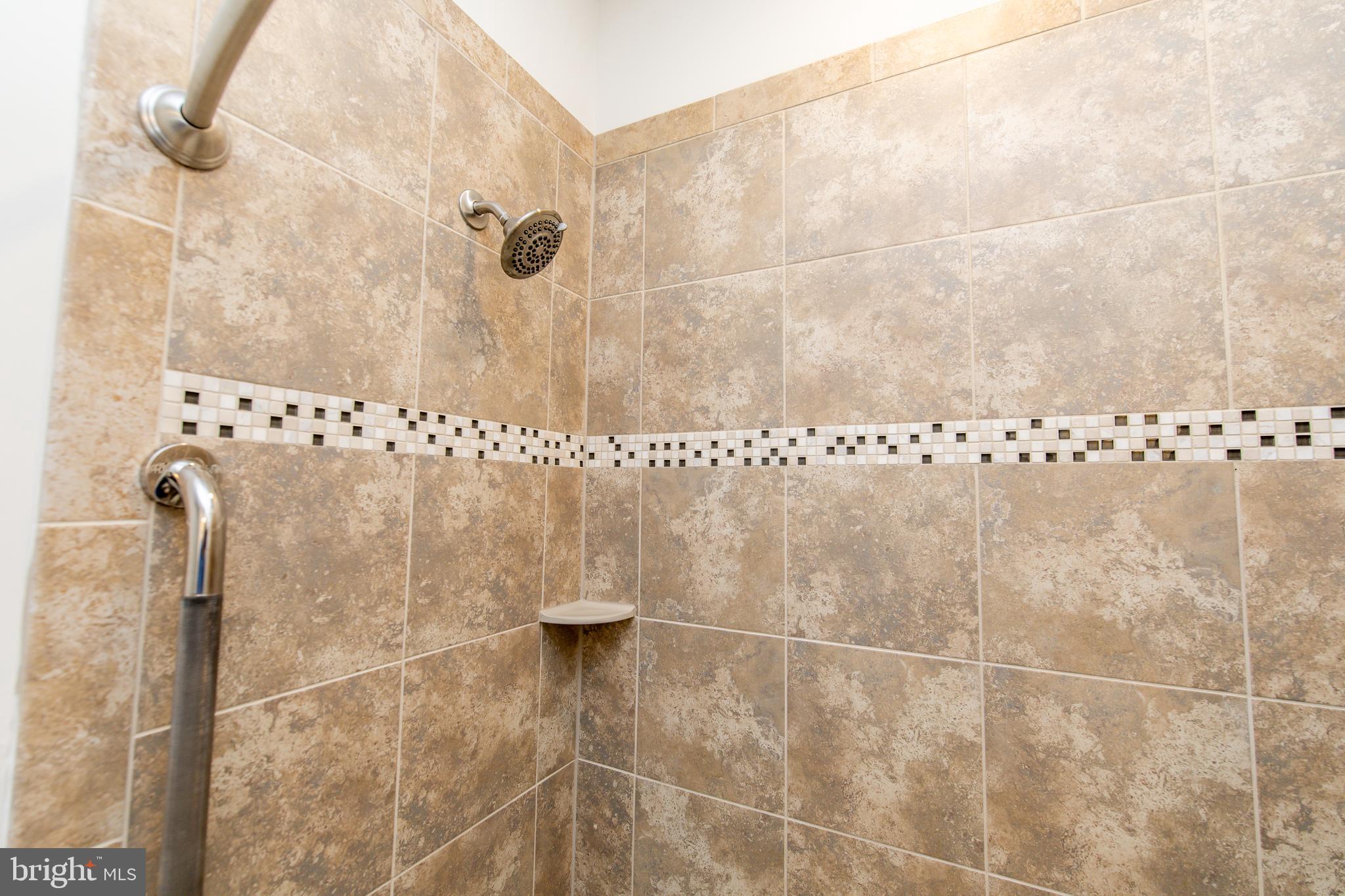 4861 Finnical Way, Unit 401 Frederick, MD 21703 - Photo 28 of 54 a bathroom with a shower