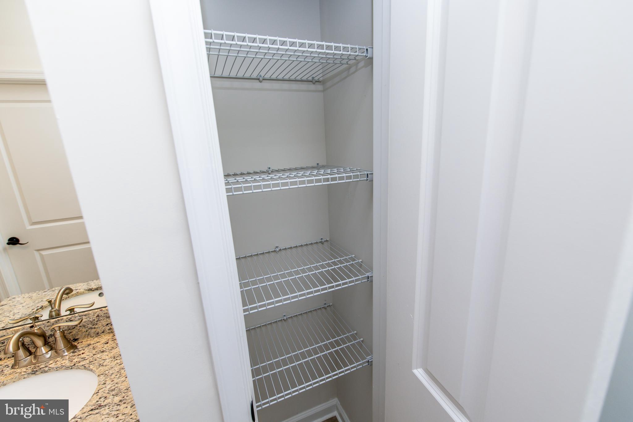 4861 Finnical Way, Unit 401 Frederick, MD 21703 - Photo 28 of 53 a bathroom with a sink