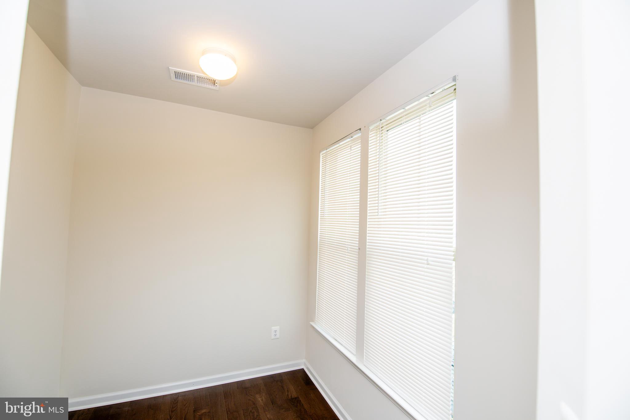 4861 Finnical Way, Unit 401 Frederick, MD 21703 - Photo 30 of 53 a view of small space with wooden floor
