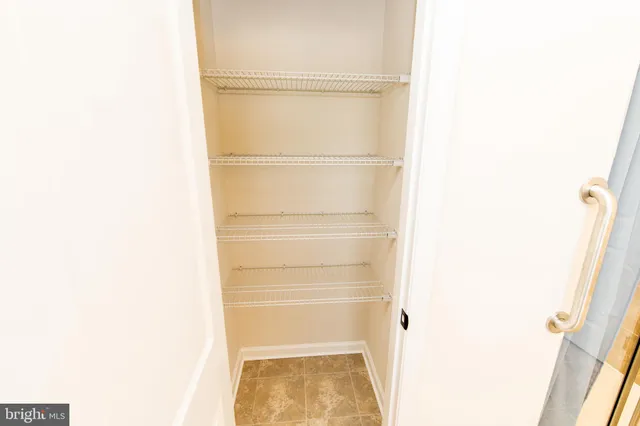 a bathroom with a shower and a glass door