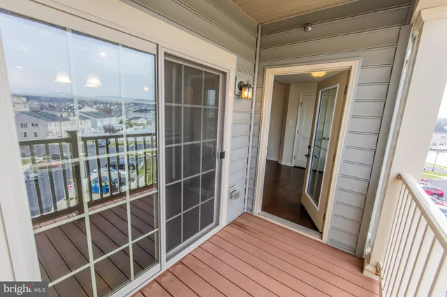 a view of workspace with furniture and wooden floor