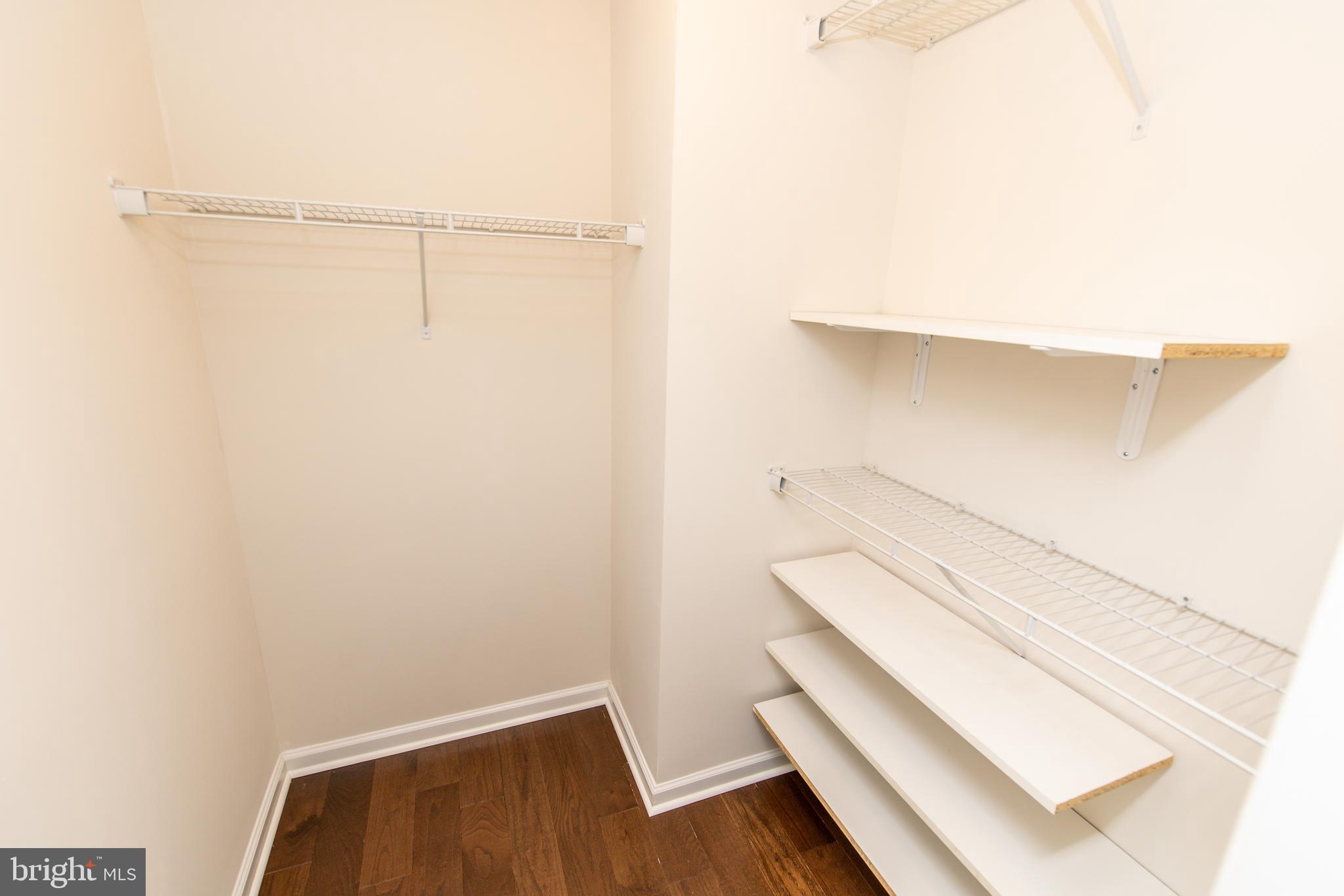 4861 Finnical Way, Unit 401 Frederick, MD 21703 - Photo 39 of 54 a view of an empty walk in closet