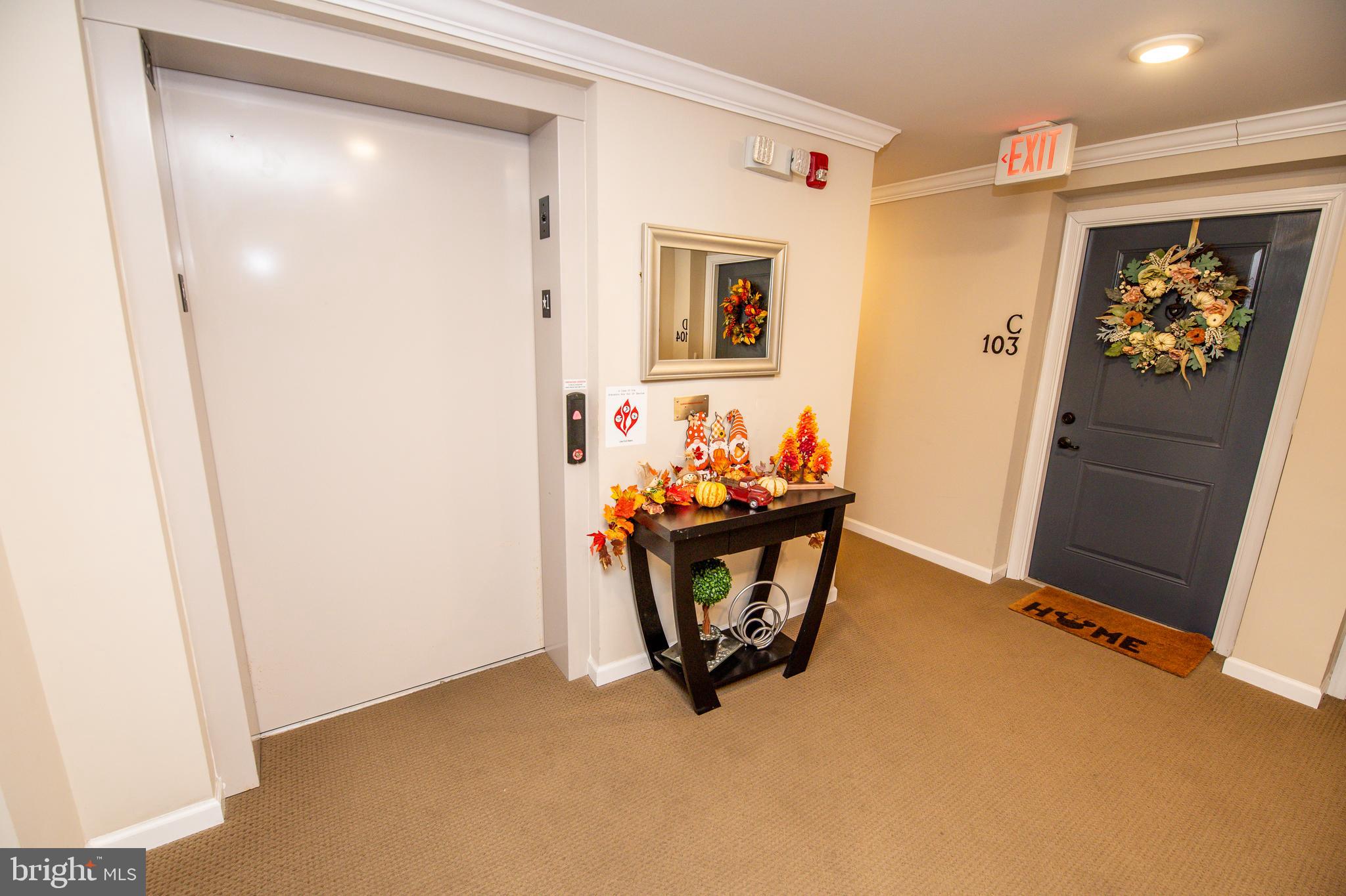 4861 Finnical Way, Unit 401 Frederick, MD 21703 - Photo 44 of 54 a view of workspace with furniture and wooden floor