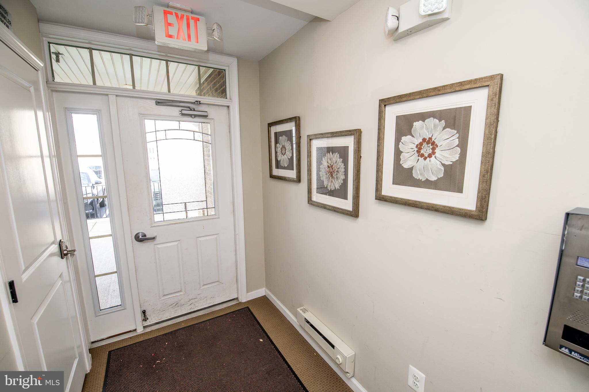 4861 Finnical Way, Unit 401 Frederick, MD 21703 - Photo 45 of 54 a view of room with window and wooden floor